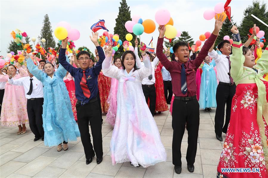 DPRK-PYONGYANG-XI JINPING-PEOPLE-WELCOME