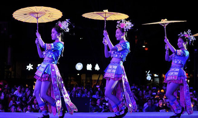 Models present traditional costumes of Miao ethnic group in China's Guizhou